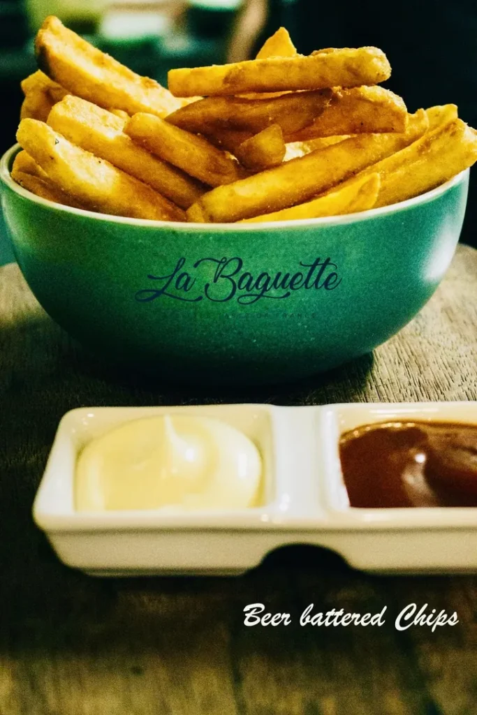 Bowl of chips with aioli and tomato sauce