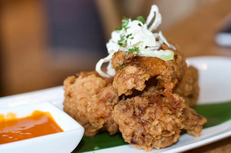 Crispy chicken broast with slaw and buffalo sauce