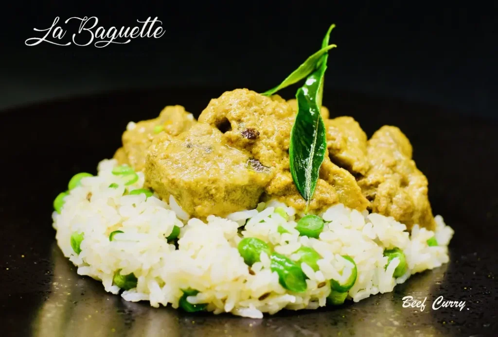 Curry of the day on buttered basmati rice with peas