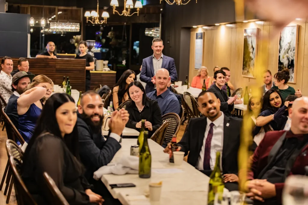 Guests seated at an evening celebration at La Baguette