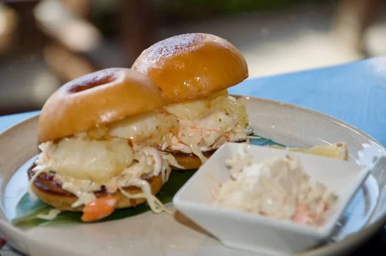 Two lobster rolls in mini brioche buns with slaw