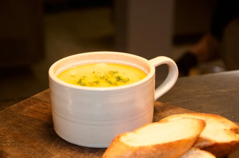 Soup of the day with toasted baguette slices